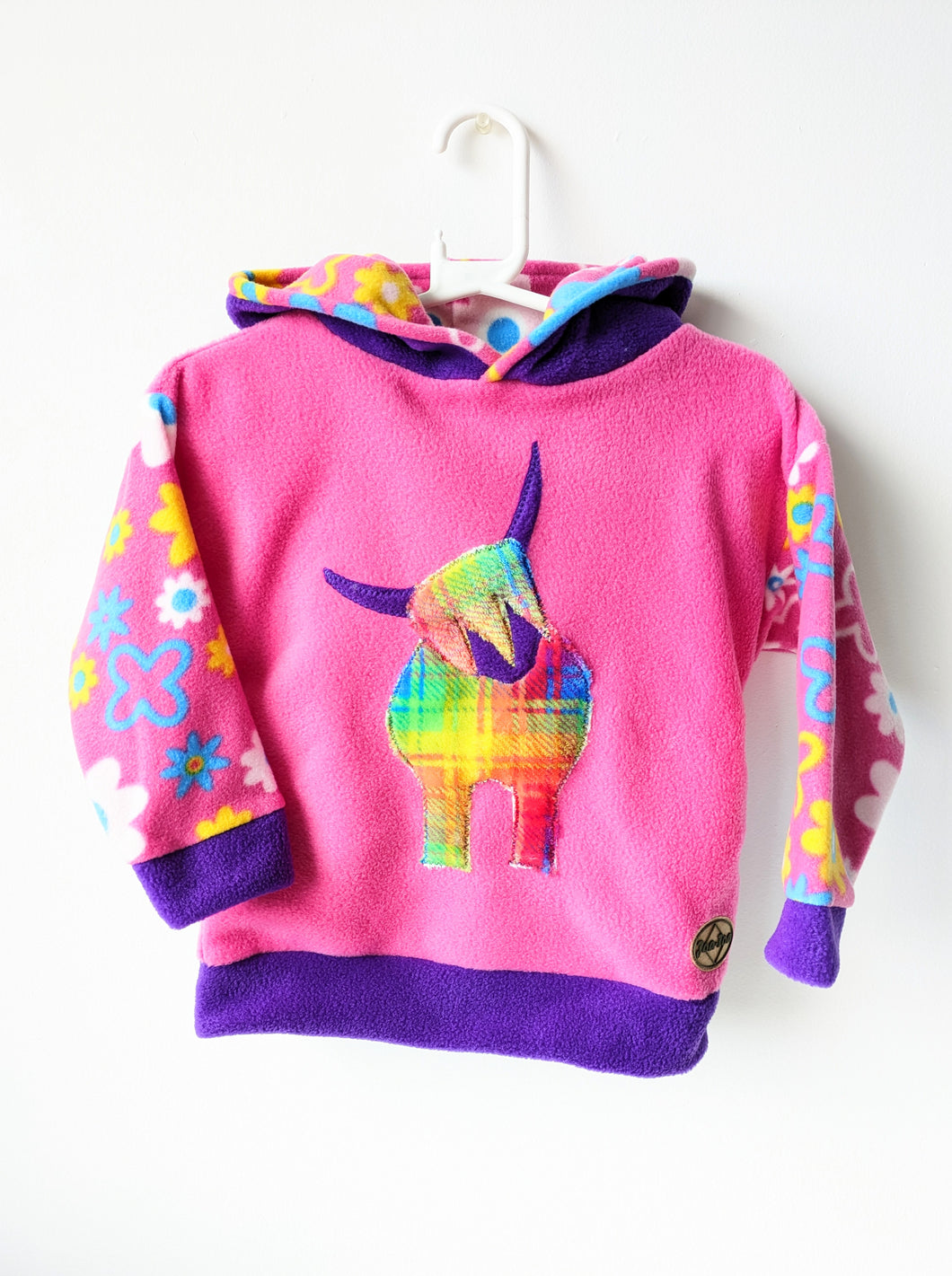 Kid's pink fleece hoodie with highland coo