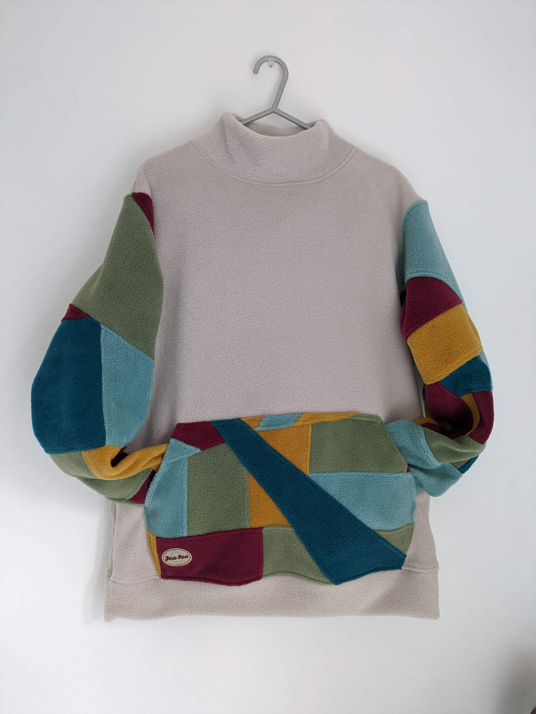 Patchwork turtleneck. Earth colours.